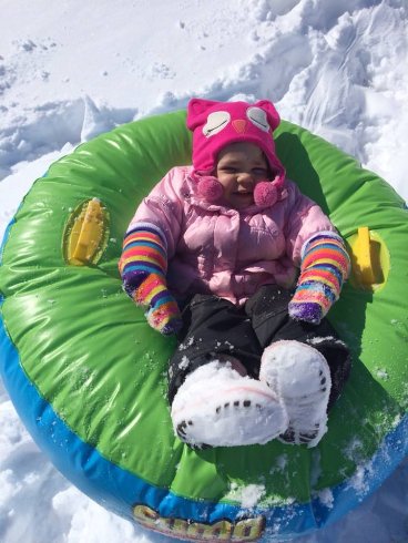 Julia snow tubing at Grammy's